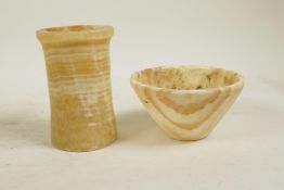An Egyptian alabaster conical bowl and an alabaster pot, largest 4" high