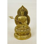 A Chinese filled gilt bronze of an emperor seated on a lotus throne, character mark verso and 4