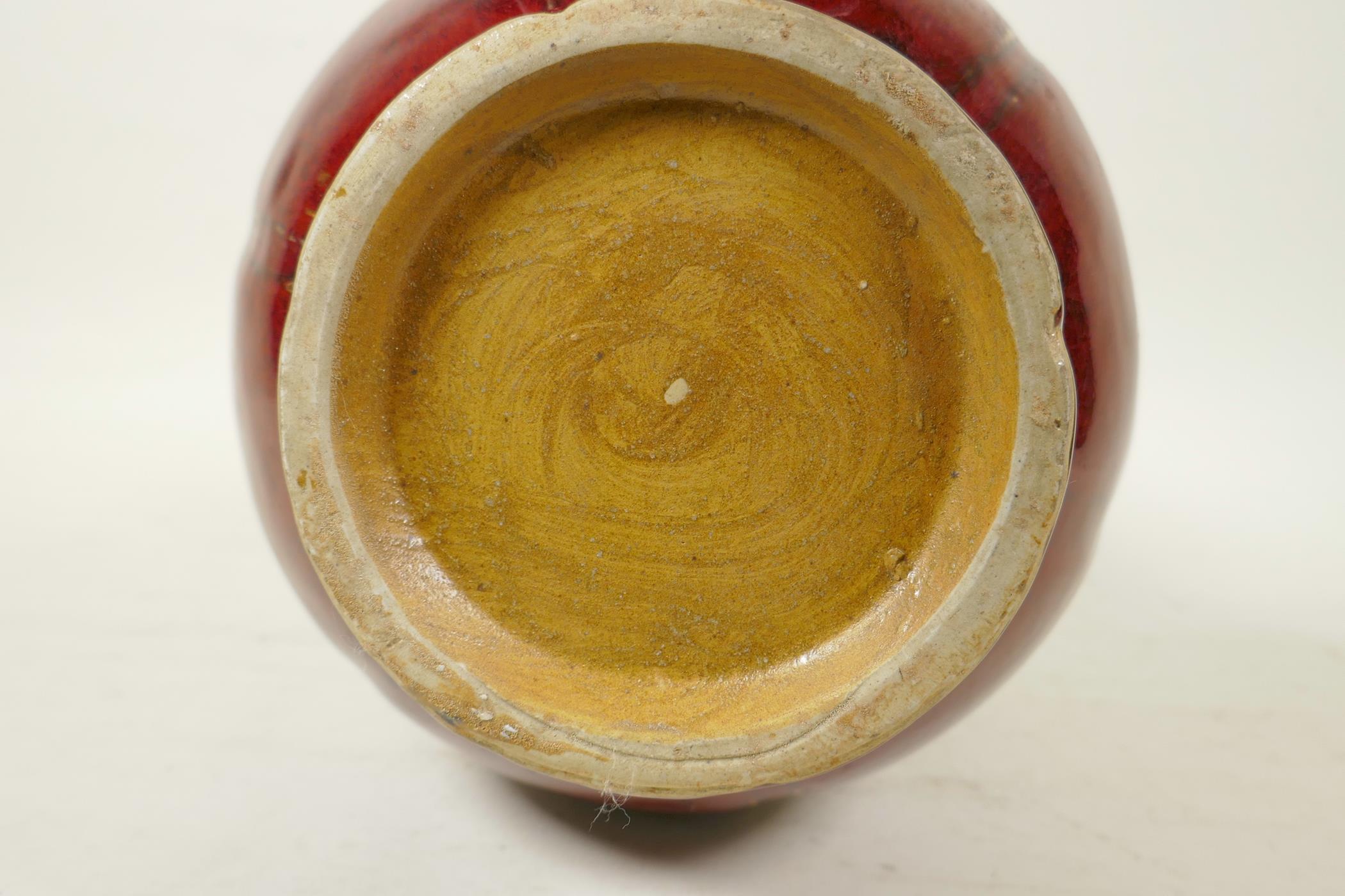 A Chinese flambe glazed pottery vase of ribbed form with a rolled rim, 9½" high - Image 4 of 4