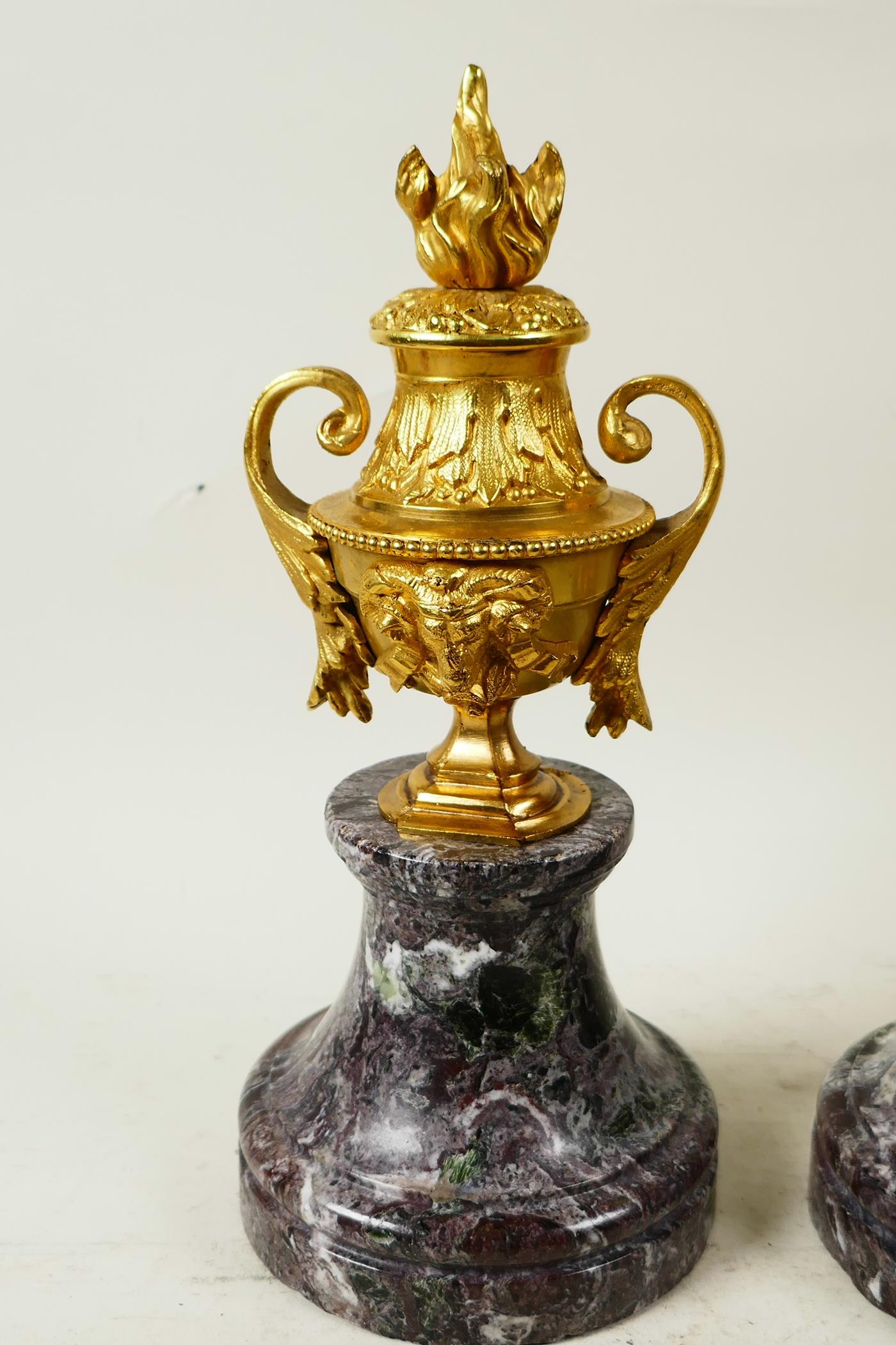 A pair of ormolu side urns with ram's mask decoration, mounted on marble socles, 10½" high - Image 2 of 3