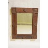 An Arts and Crafts oak wall mirror, 20" x 25"