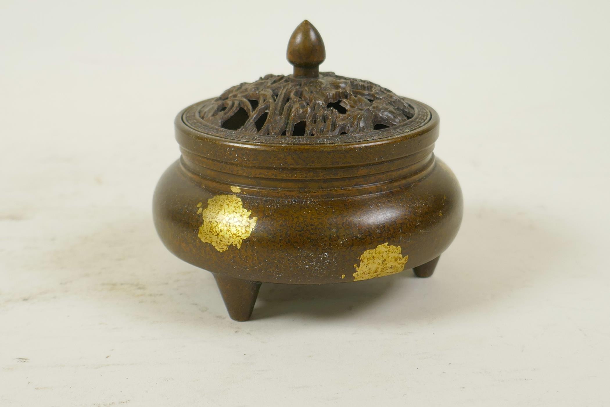 A Chinese gilt splash bronze censer and cover on tripod feet, the pierced cover decorated with - Image 2 of 5