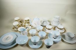 A quantity of porcelain including a pair of Limoges Philippe Deshoulieres Orleans pattern teacups