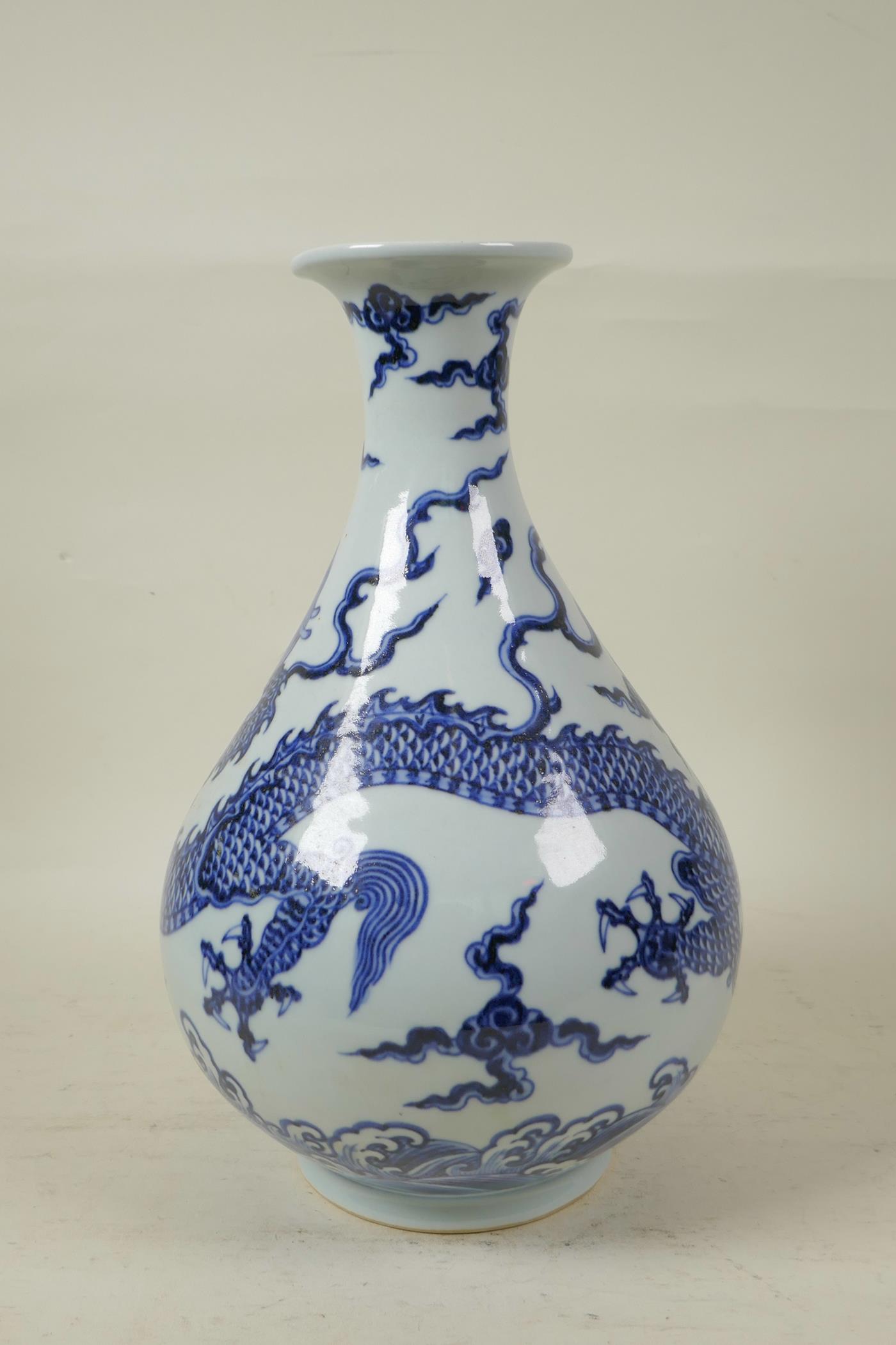 A Chinese blue and white porcelain pear shaped vase decorated with a dragon in flight, 12" high - Image 2 of 4