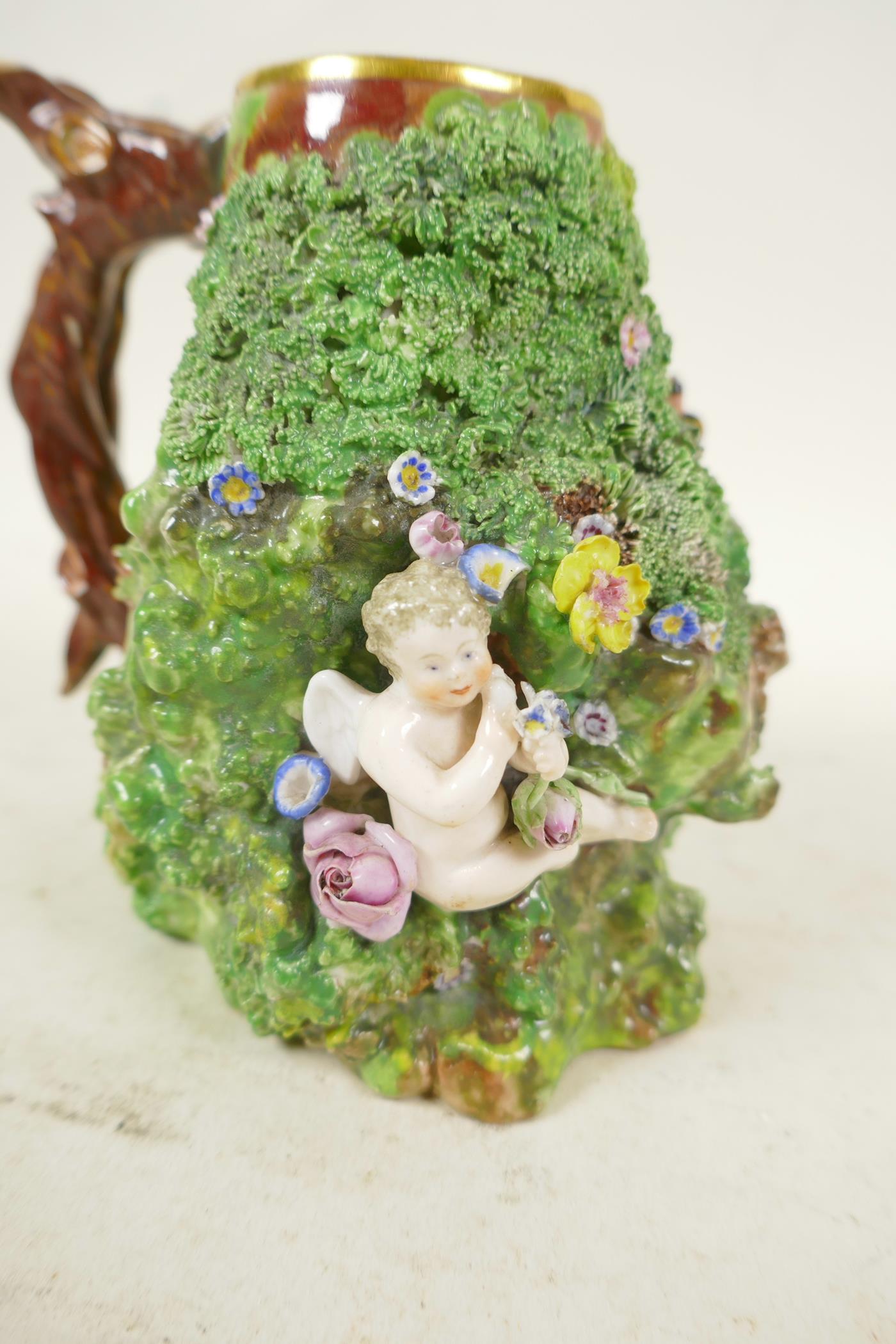 A Palissy style vase with single branch style handle, the body moulded with cherub, bird's nest - Image 2 of 4