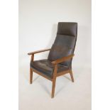 A Parker Knoll beechwood open armchair with leatherette covers