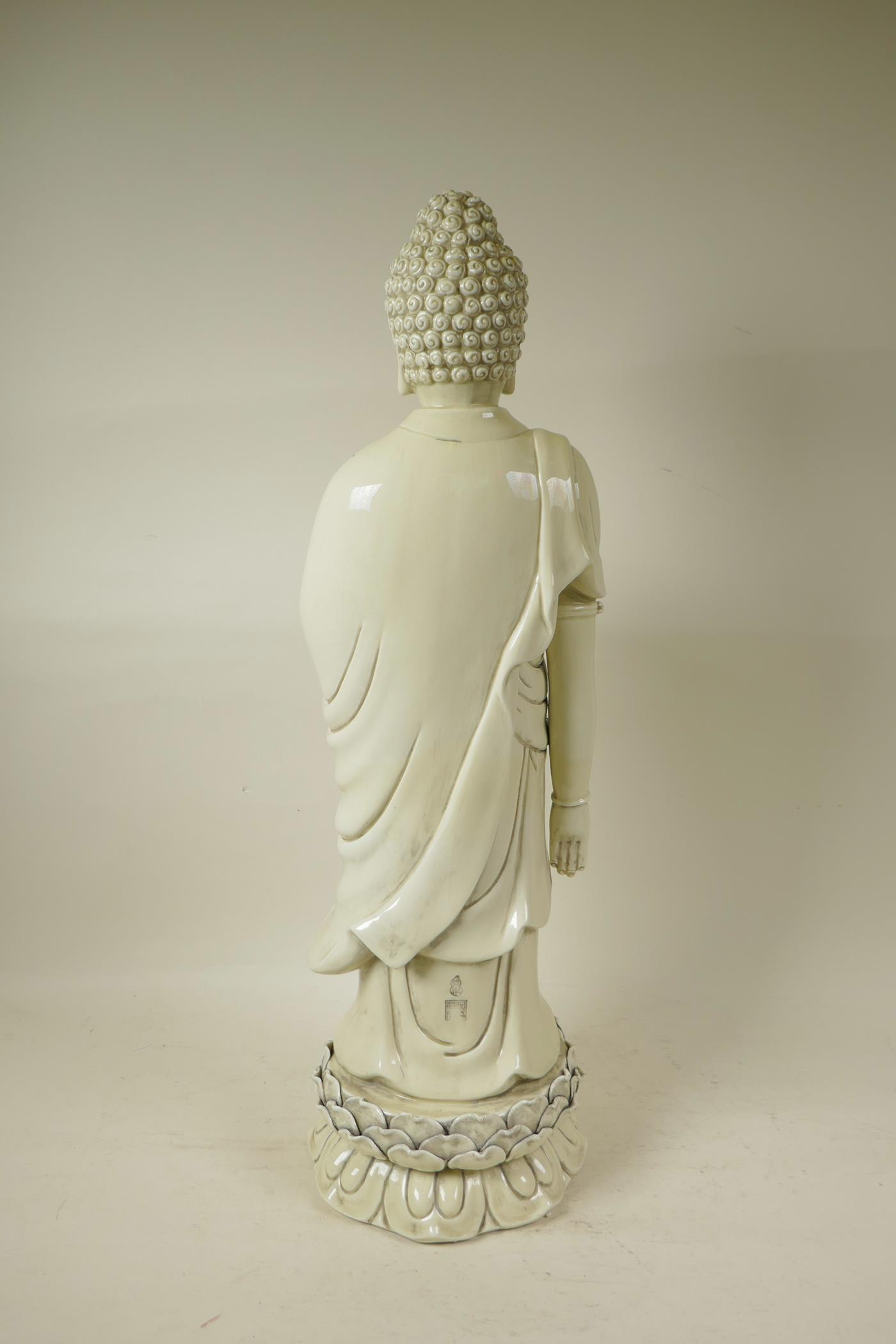 A Chinese blanc de chine porcelain porcelain figure of Buddha standing on a lotus throne, - Image 3 of 5
