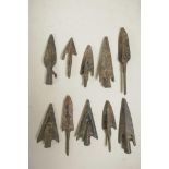 A collection of ten archaic style bronze arrowheads, 3" longest