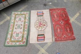 Three oriental wool rugs, largest 55" x 30"