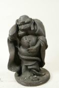 A Japanese bronze figure of a traveller with a sack on his back, 8" high