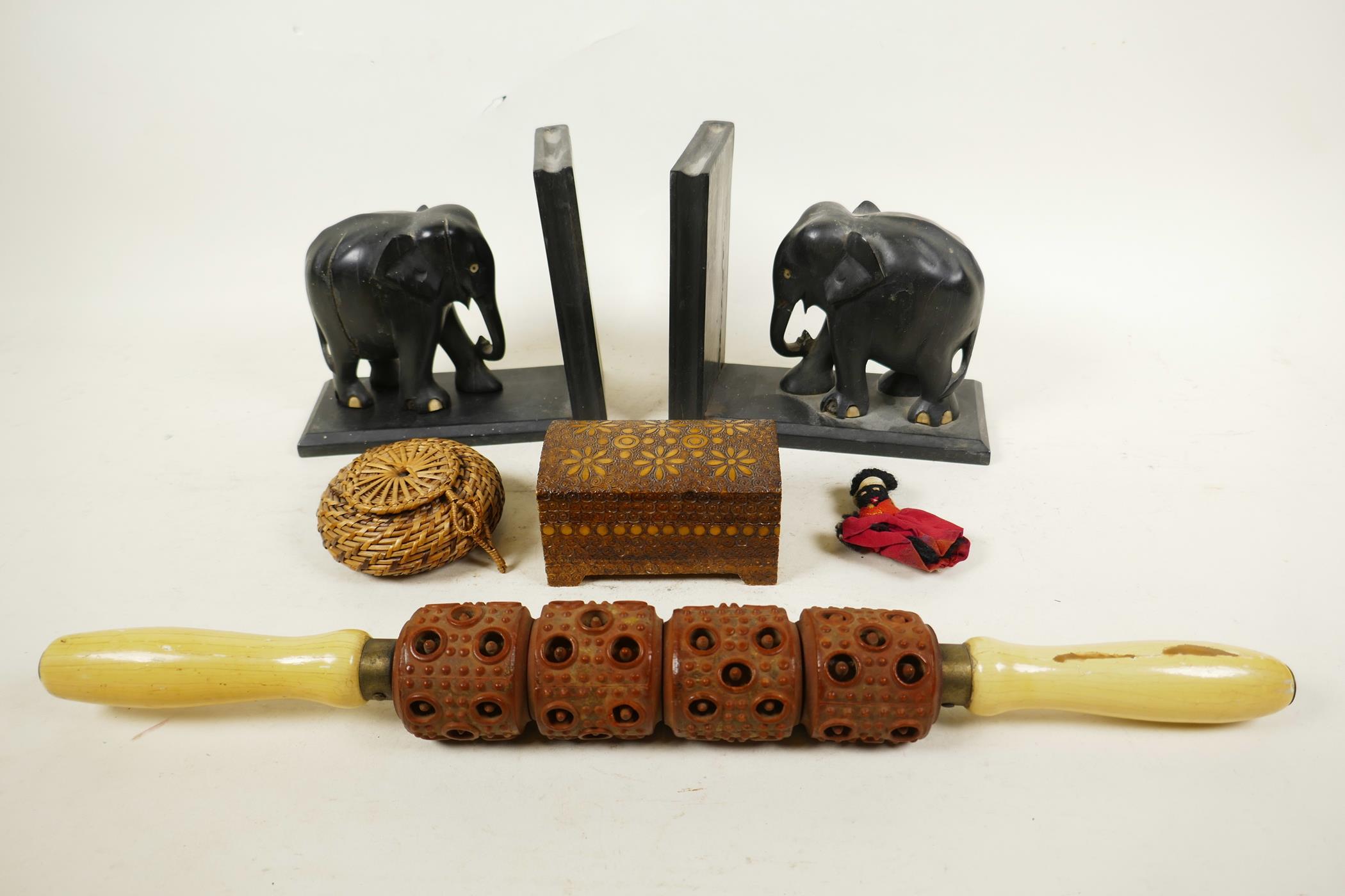 A pair of early C20th ebony carved elephant bookends, one detached from stand, 6" high x 6½" wide,