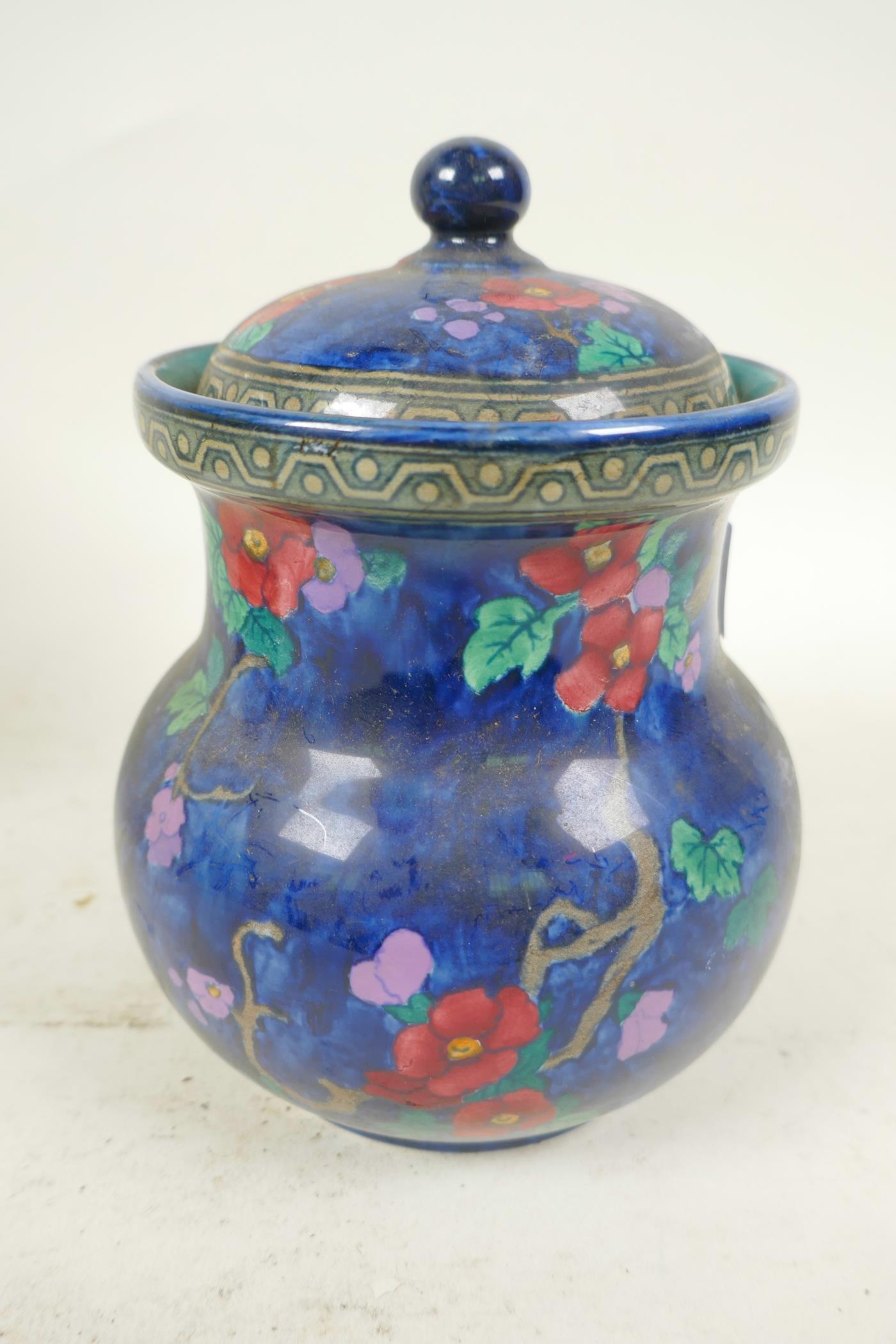 A Losol ware Andes pattern jar and cover decorated with parrot and flowers on a lustre blue - Image 3 of 4