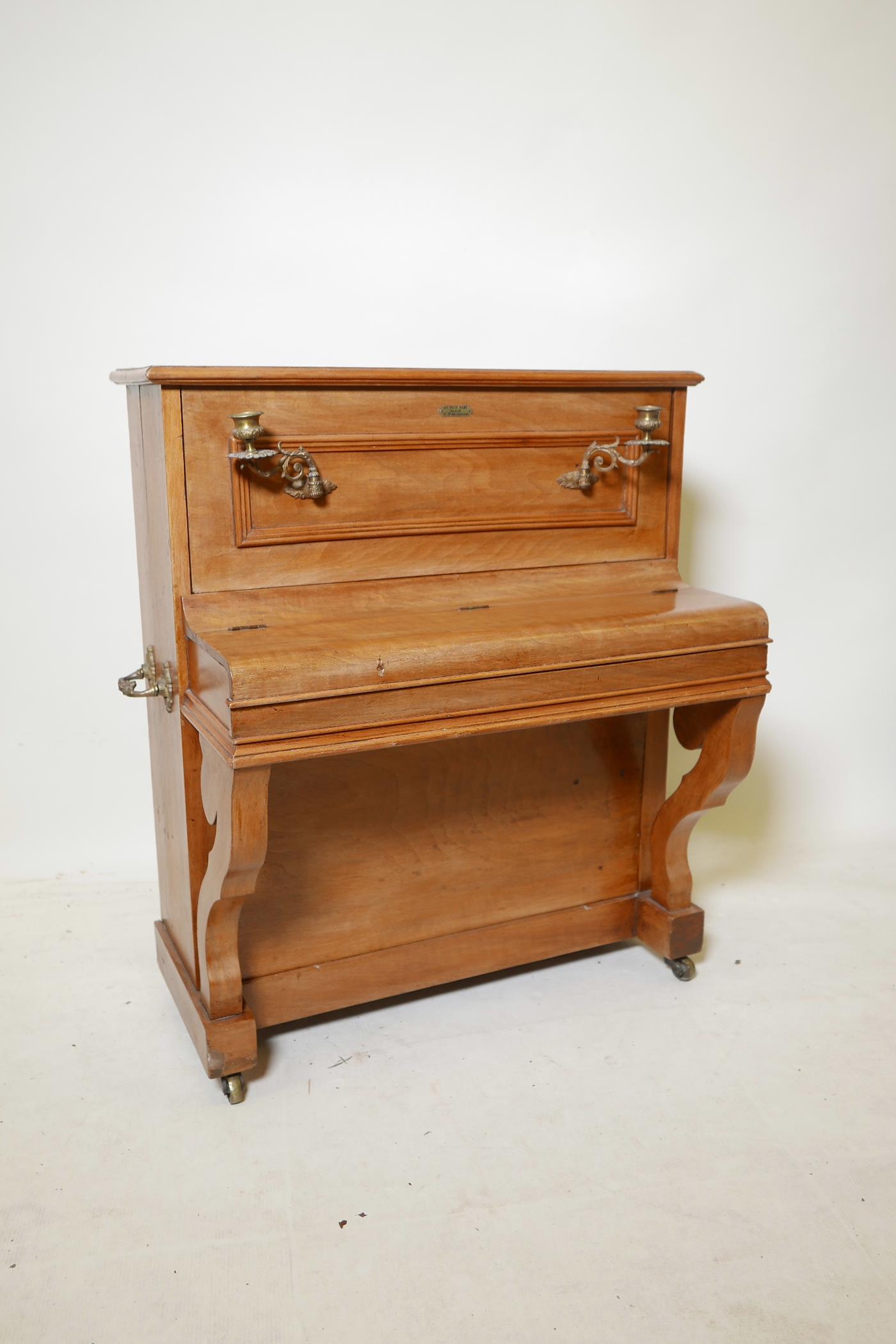 A late C19th/early C20th French child's toy grand piano, labelled Au Nain Bleu, Paris, 27 Bd des