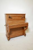 A late C19th/early C20th French child's toy grand piano, labelled Au Nain Bleu, Paris, 27 Bd des