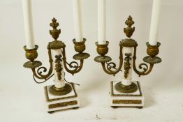 A pair of French marble and ormolu two light table candelabra of classical form, converted to