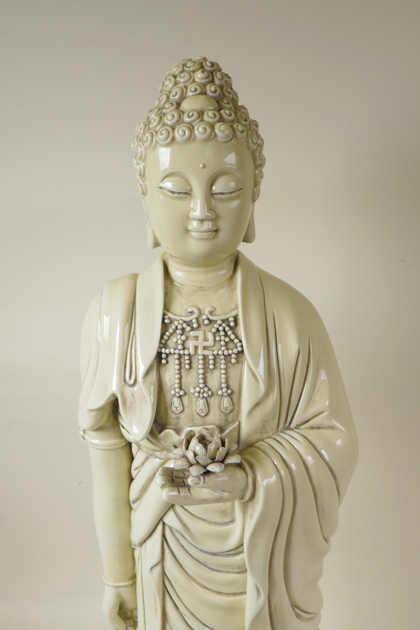 A Chinese blanc de chine porcelain porcelain figure of Buddha standing on a lotus throne, - Image 2 of 5