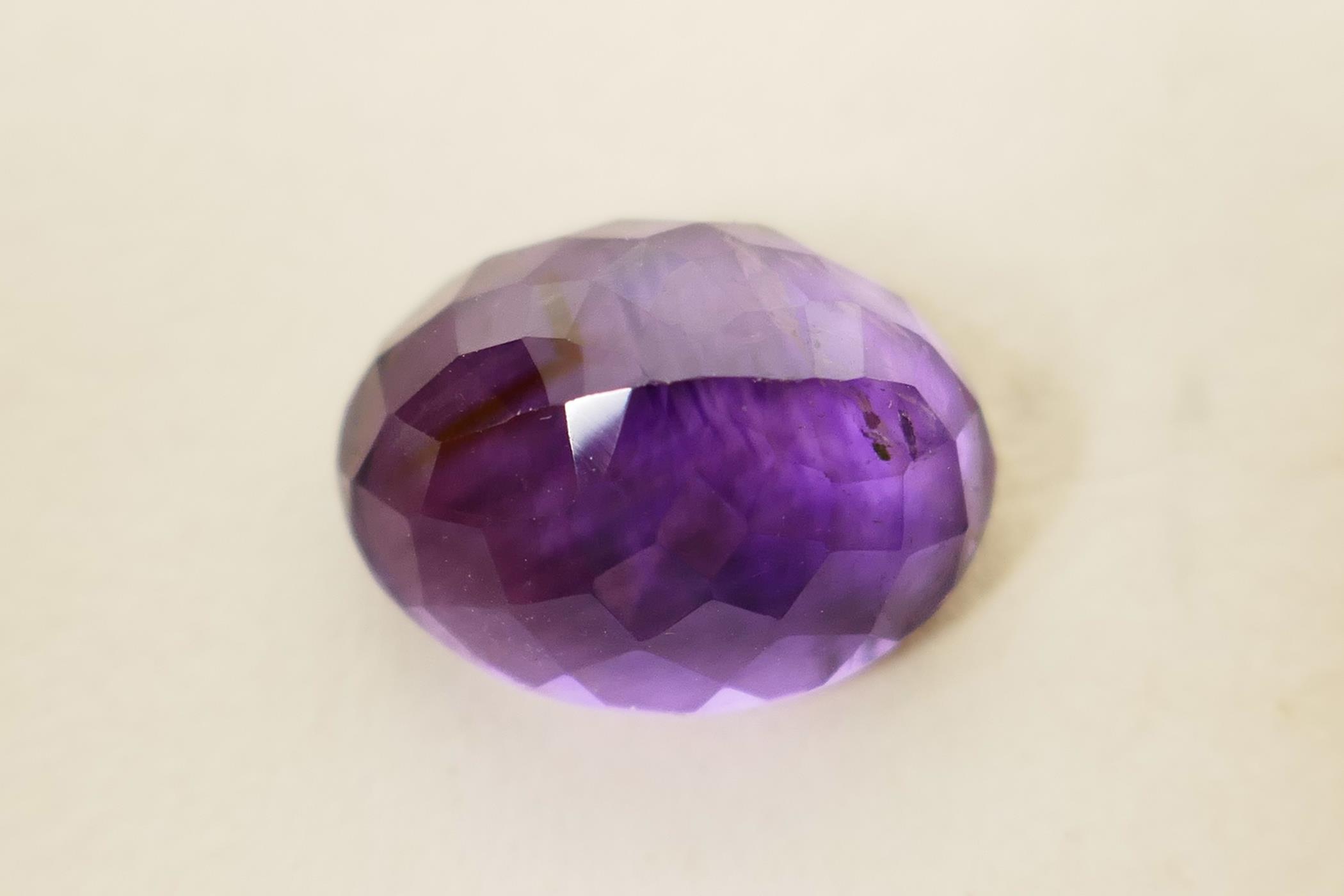 A 6.04ct natural dark purple amethyst, oval mixed cut, certified laboratory tested, with certificate - Image 4 of 5