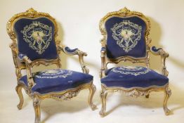 A pair of Continental style carved giltwood open armchairs, the covers with metal thread embroidery