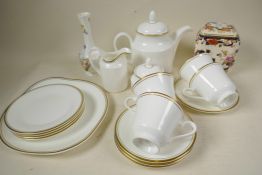 A Royal Doulton gold Concorde pattern white and gilt tea service comprising teapot, milk jug and