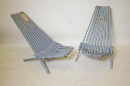 A pair of Scandinavian painted and slatted teak folding outdoor chairs