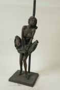 A bronzed metal figural table lamp base, the figure cast as Marilyn Monroe holding her skirt in