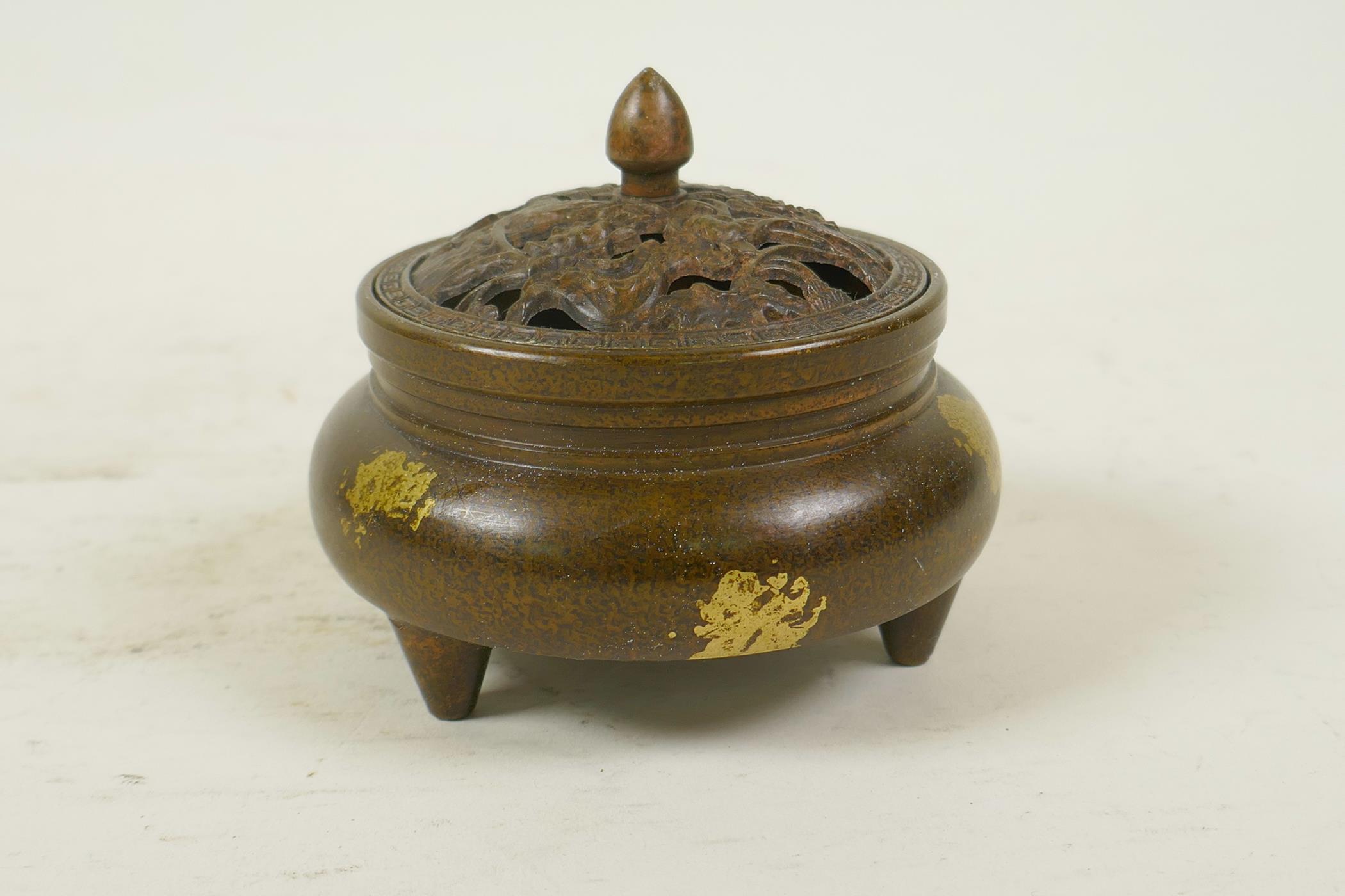 A Chinese gilt splash bronze censer and cover on tripod feet, the pierced cover decorated with - Image 3 of 5