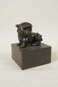 A Chinese filled bronze seal with a temple lion knop, 4" x 4", 5" high