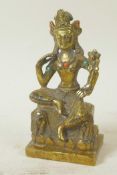 A Sino-Tibetan gilt brass figure of a seated deity embellished with turquoise and coral beads, 5½"