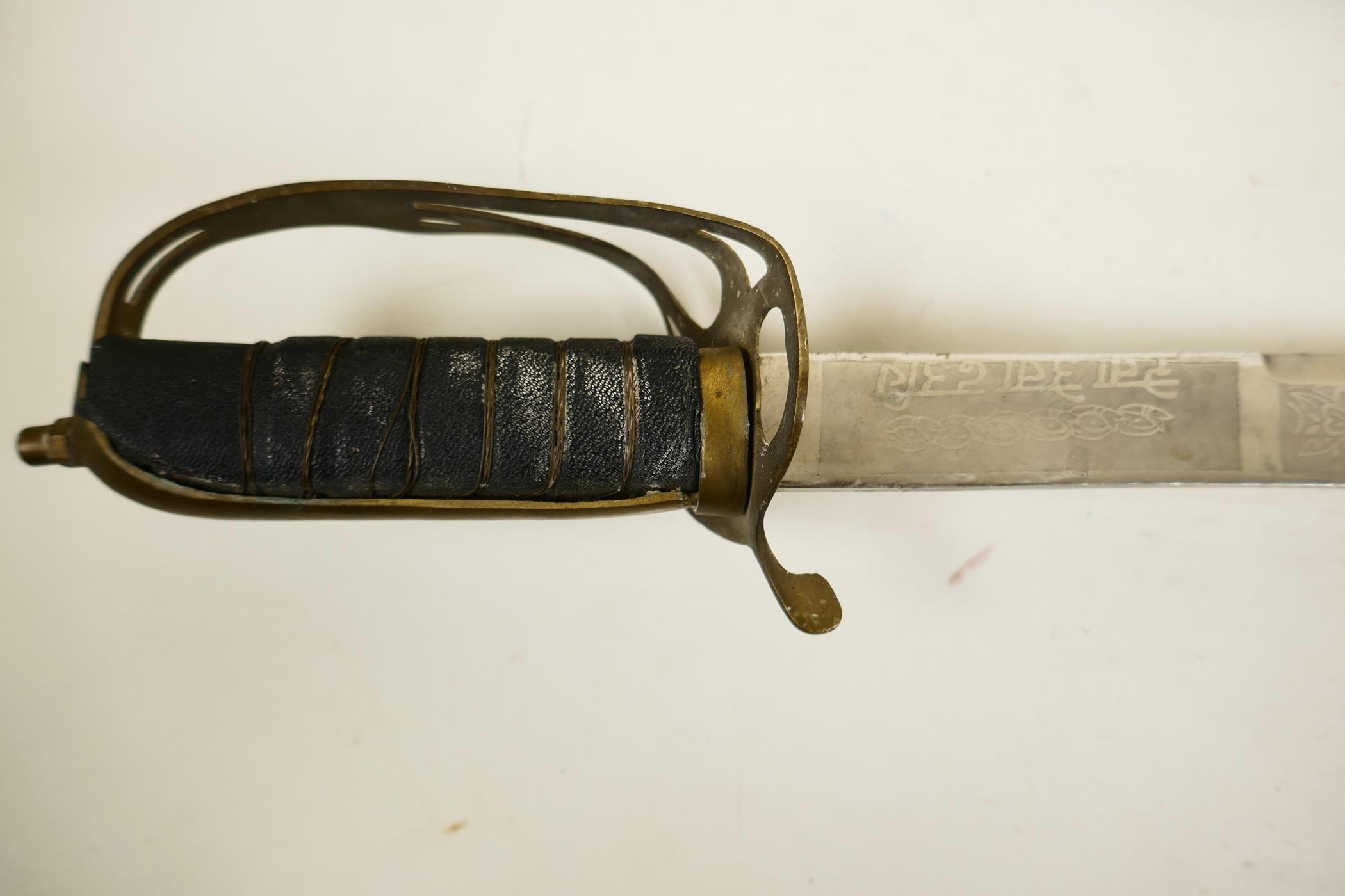 An Indian ceremonial cavalry sword, a WWI replica sabre with 'Made in India' etched to the hilt - Image 5 of 8