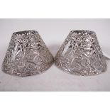 A pair of pierced silver candle shades, marked Gorham Co., 5" diameter, 3" high