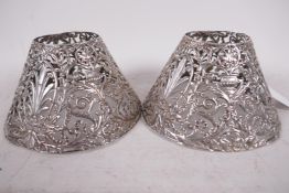 A pair of pierced silver candle shades, marked Gorham Co., 5" diameter, 3" high