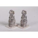 A pair of silver plated condiments in the form of rabbits, stamped 800, 2½" high