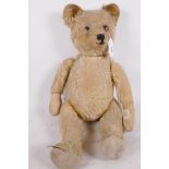 A well loved vintage teddy bear, 20" long