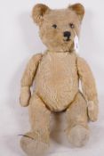 A well loved vintage teddy bear, 20" long