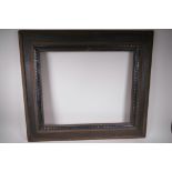A C19th/20th Dutch style ebonised picture frame with ripple decoration, 24½" x 20" aperture