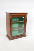 A small mahogany display cabinet with single glazed door and brass mounts, 21" x 11" x 27"