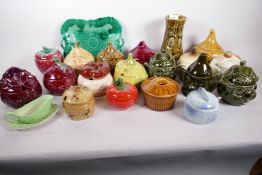 A collection of twenty one novelty kitchen and table pottery jars and plates including Sylvac,