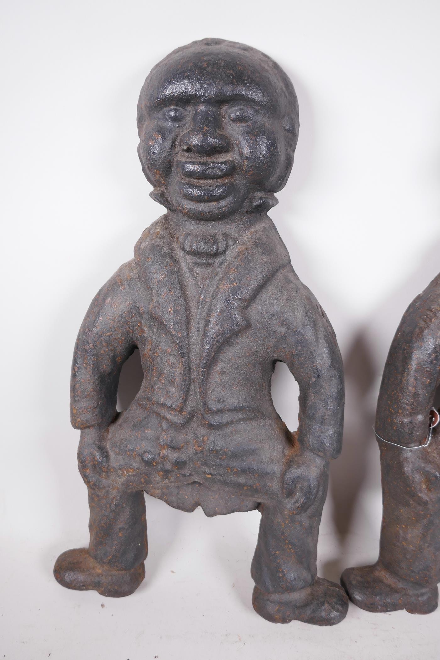 A pair of cast iron fire dog ends in the form of blackamoors, 16" high - Image 2 of 3