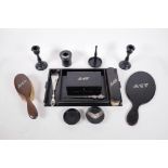 An early C20th ebony dressing table set personalised with silver initials, tray 13" x 7½"