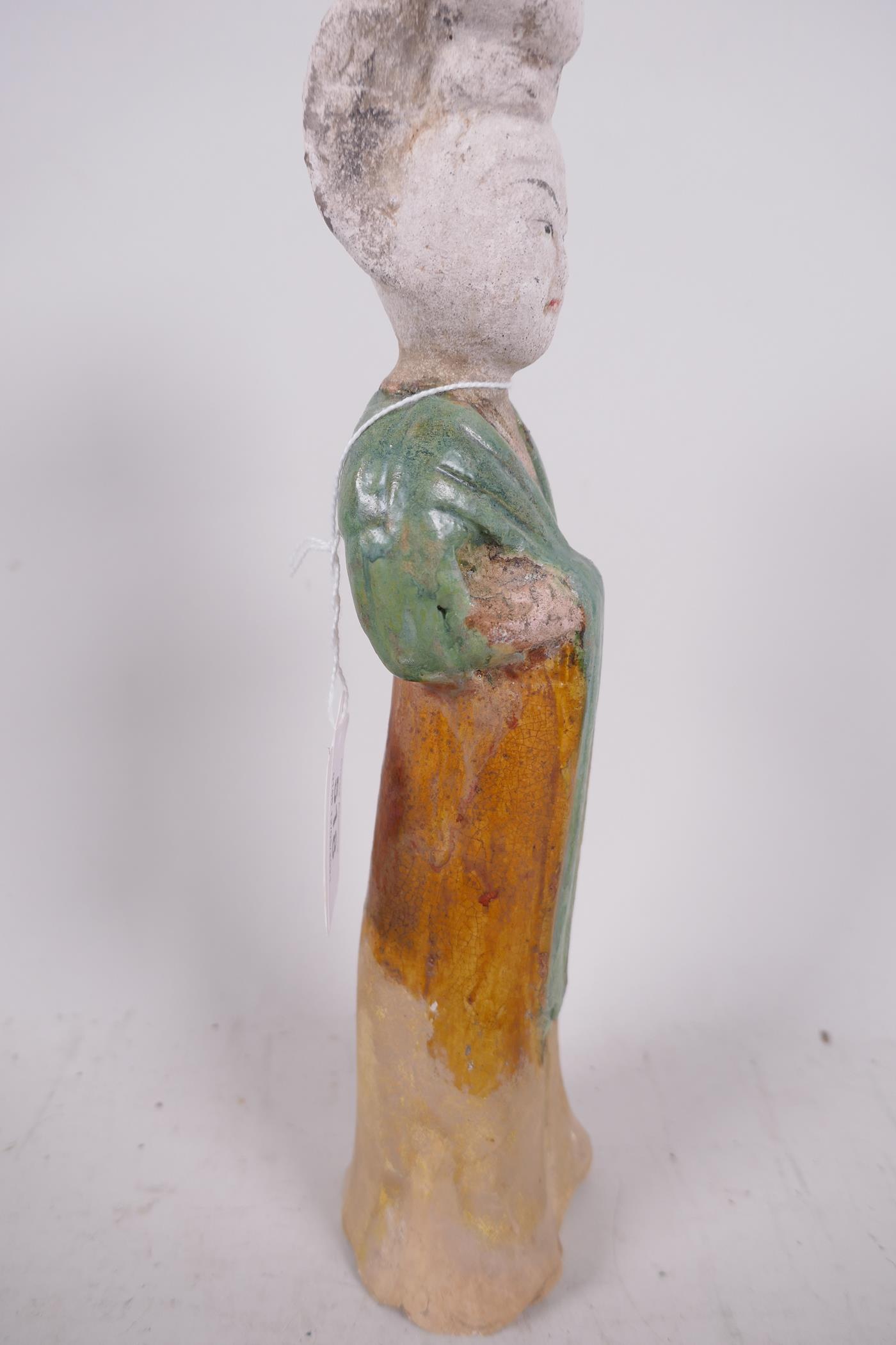A Chinese Tang dynasty (618-907AD) terracotta figure of a court lady, Sancai glazed in original - Image 3 of 6