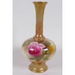 A Royal Worcester porcelain bud vase with blush body painted with roses, long neck and foot enhanced