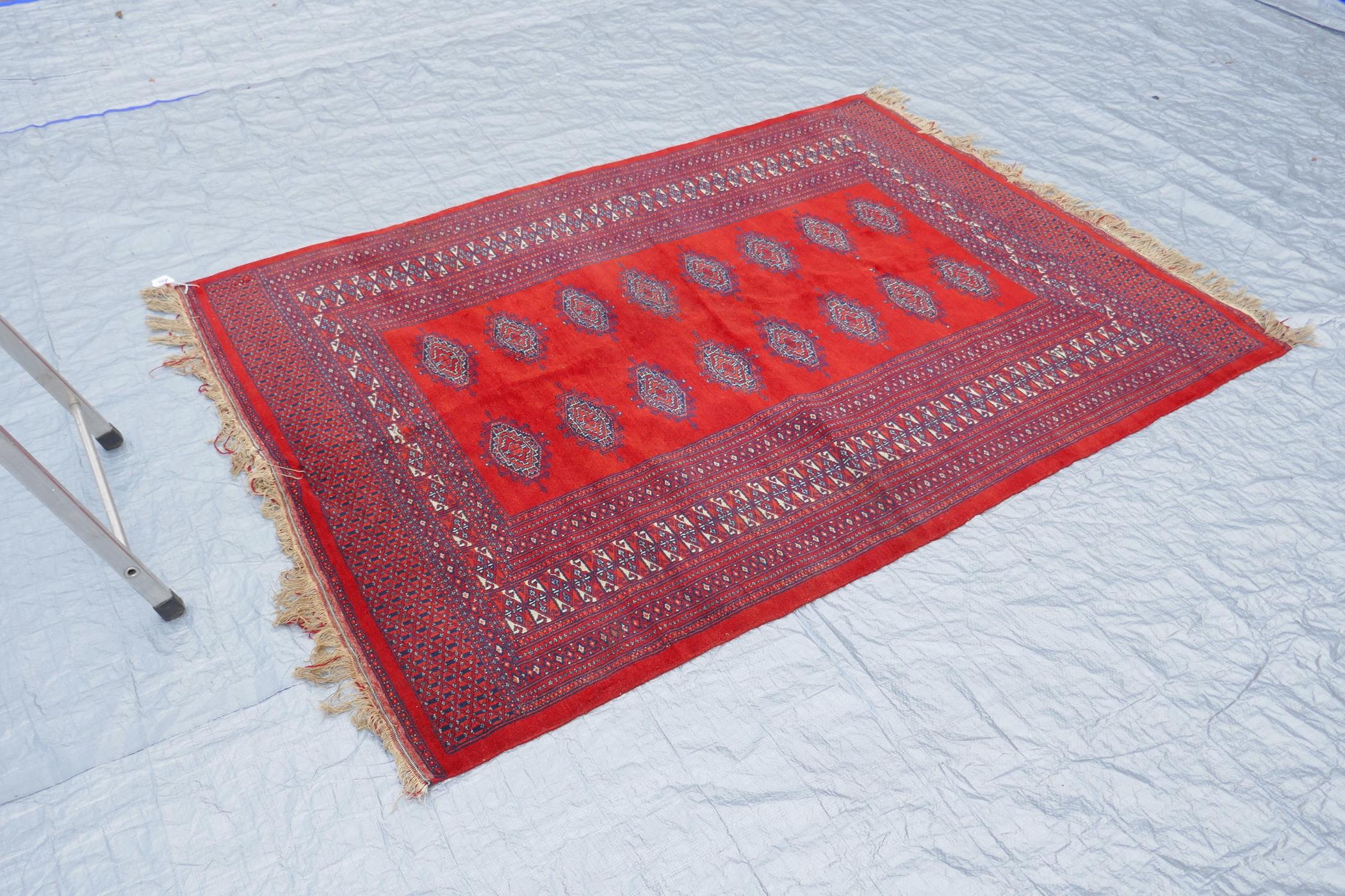 A Turkmen tomato ground wool carpet with a Bokhara design, 51" x 72" - Image 3 of 6