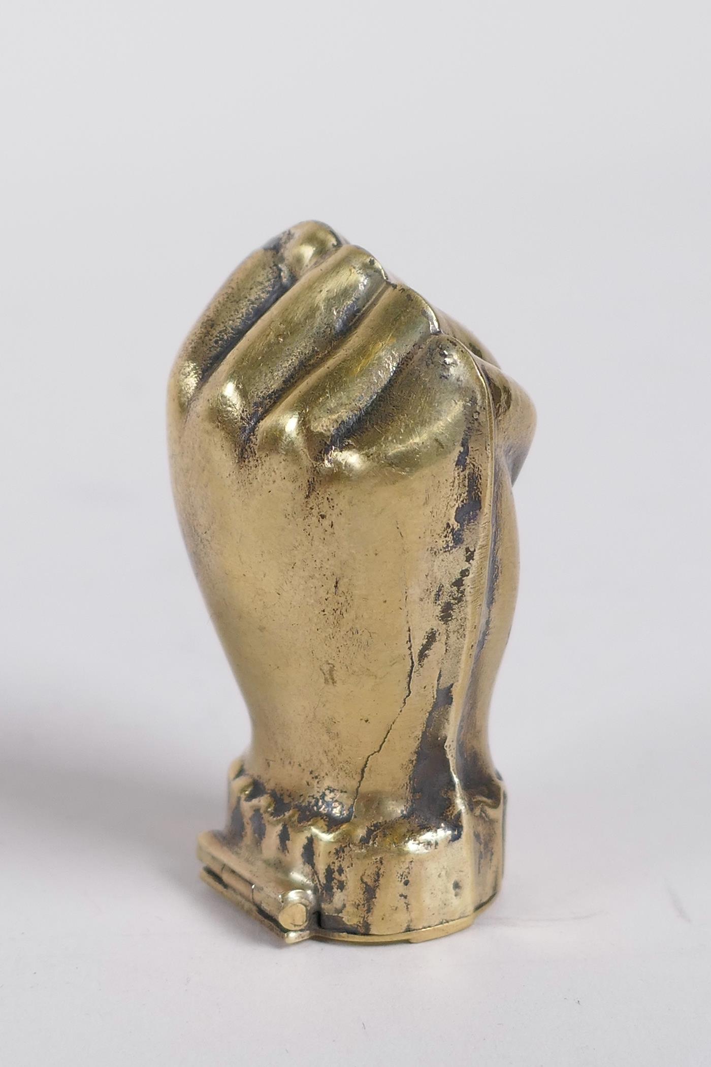 A brass vesta case in the form of a clenched fist, 1½" - Image 2 of 2