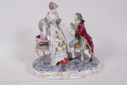 A German hard paste porcelain figure of a young man proposing to his beloved, 9" high