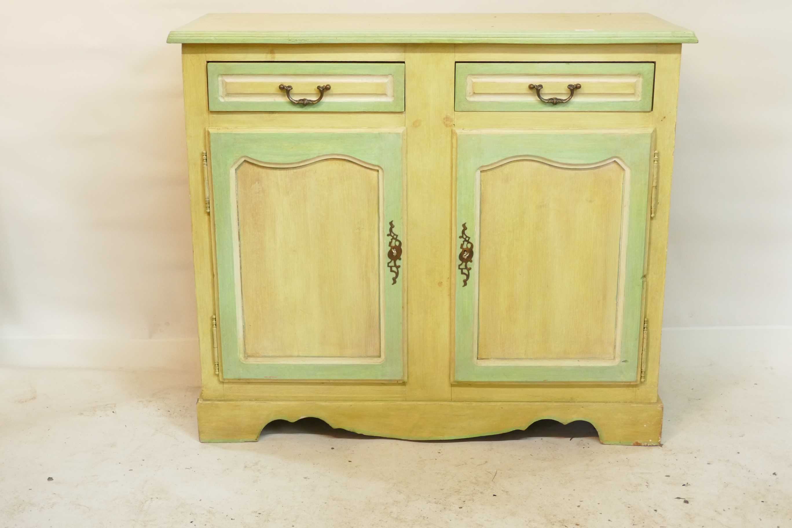 A painted pine buffet with two drawers over two doors, raised on bracket feet, 42" x 17½", 36" high