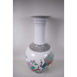 A Chinese famille rose porcelain floor vase, mid C20th, painted with a pair of peacocks, peony