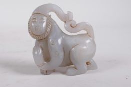 A Chinese carved celadon jade monkey, 3" long