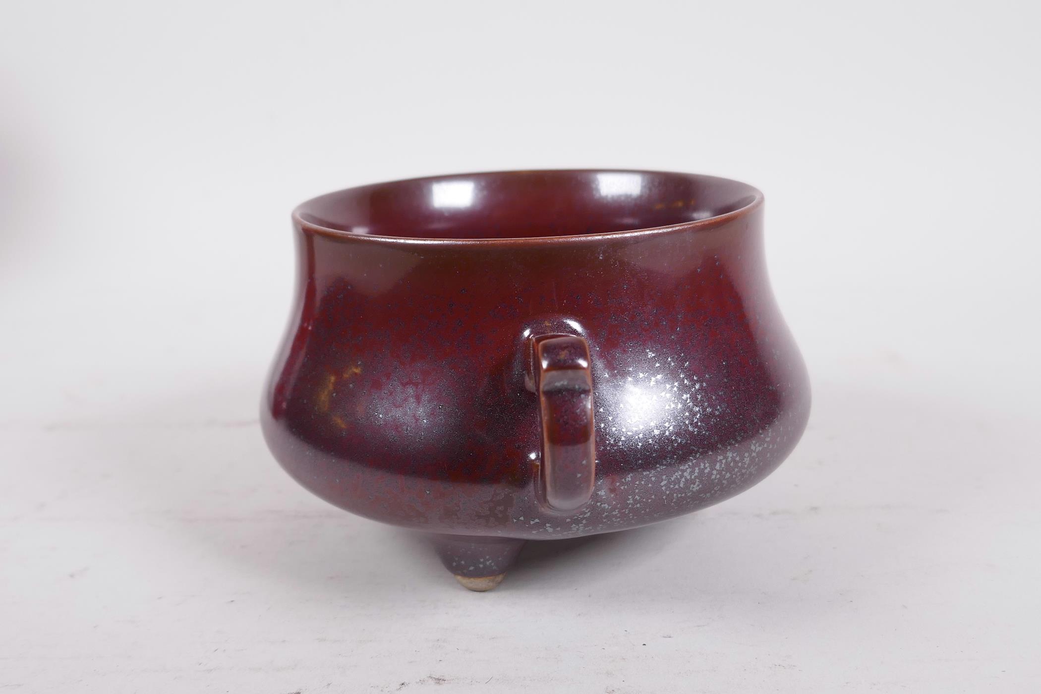 A Chinese iridescent copper glazed porcelain censer raised on tripod supports with two handles, - Image 4 of 7