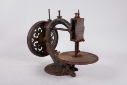 A late C19th Wanzer 'Time Utilize' sewing machine, no.55023, 13" long
