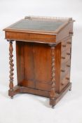 A Victorian rosewood davenport, with pierced brass gallery top, leather inset fall, four true and